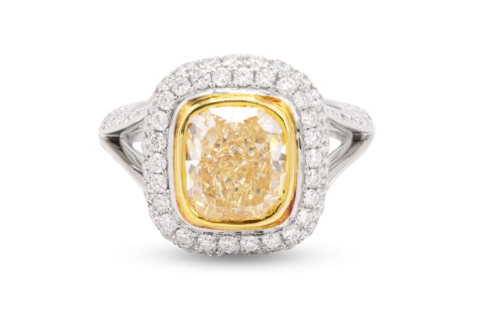 Platinum and 18K Yellow Gold Fancy Yellow Diamond Ring set with one cushion diamond (3.30ct