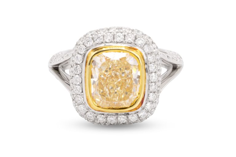 Platinum and 18K Yellow Gold Fancy Yellow Diamond Ring set with one cushion diamond (3.30ct