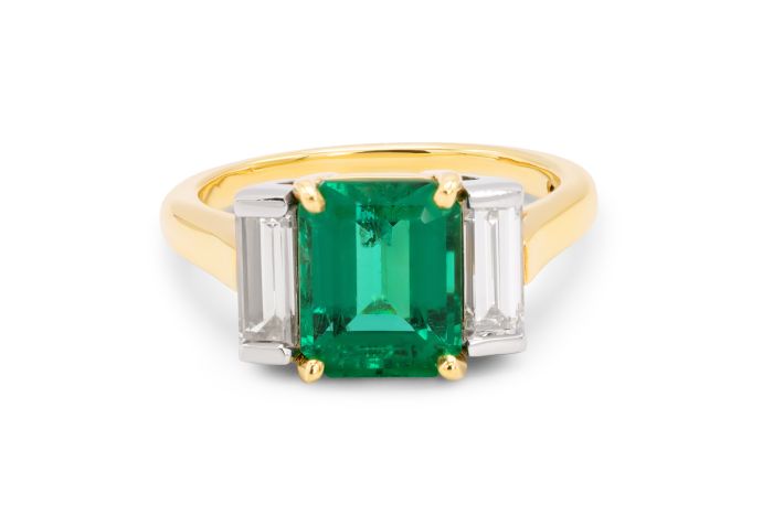 18K Yellow Gold Platinum Emerald and Diamond Ring set with 1 emerald cut emerald (2.87ct) and pair of straight baguette diamonds (0.78ctw)