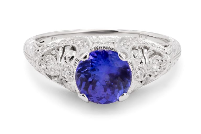 14K White Gold Tanzanite and Diamond Ring set with a round tanzanite (1.41ct) and 45 round full cut diamonds (0.42ctw) (H